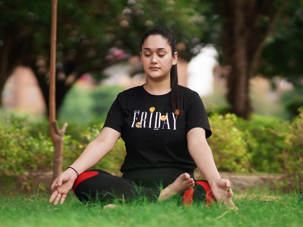 front-view-indian-woman-while-meditating-park